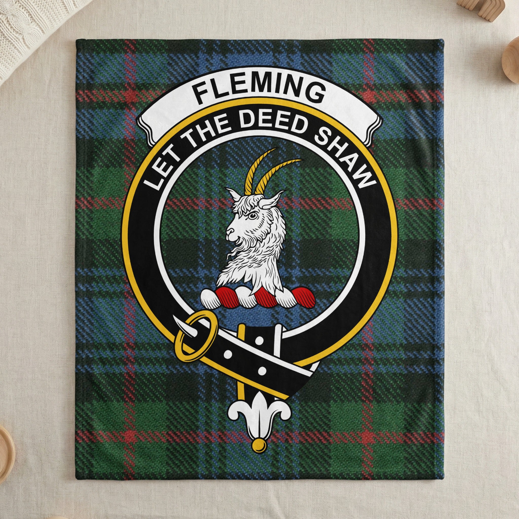 Fleming clan tartan throw blanket with crest — draped display
