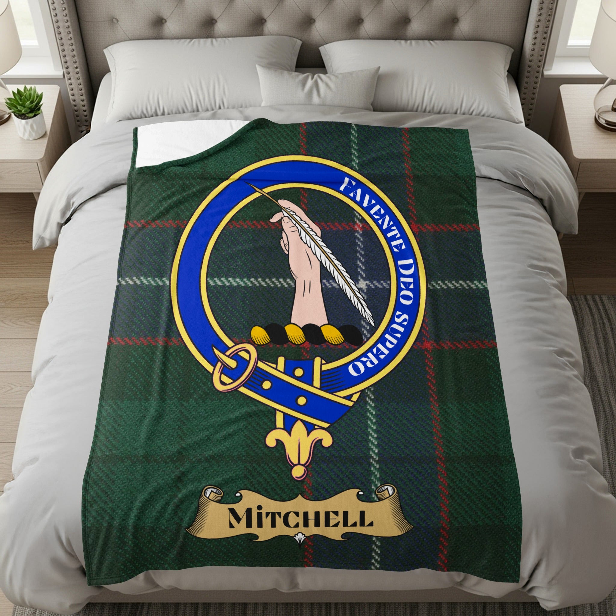 Mitchell crest with Celtic knot and quill on green tartan throw