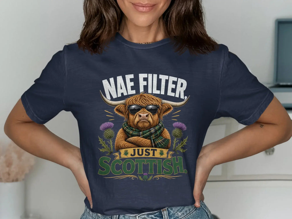 Highland cow wearing sunglasses and a tartan scarf with "Nae Filter Just Scottish" text.
