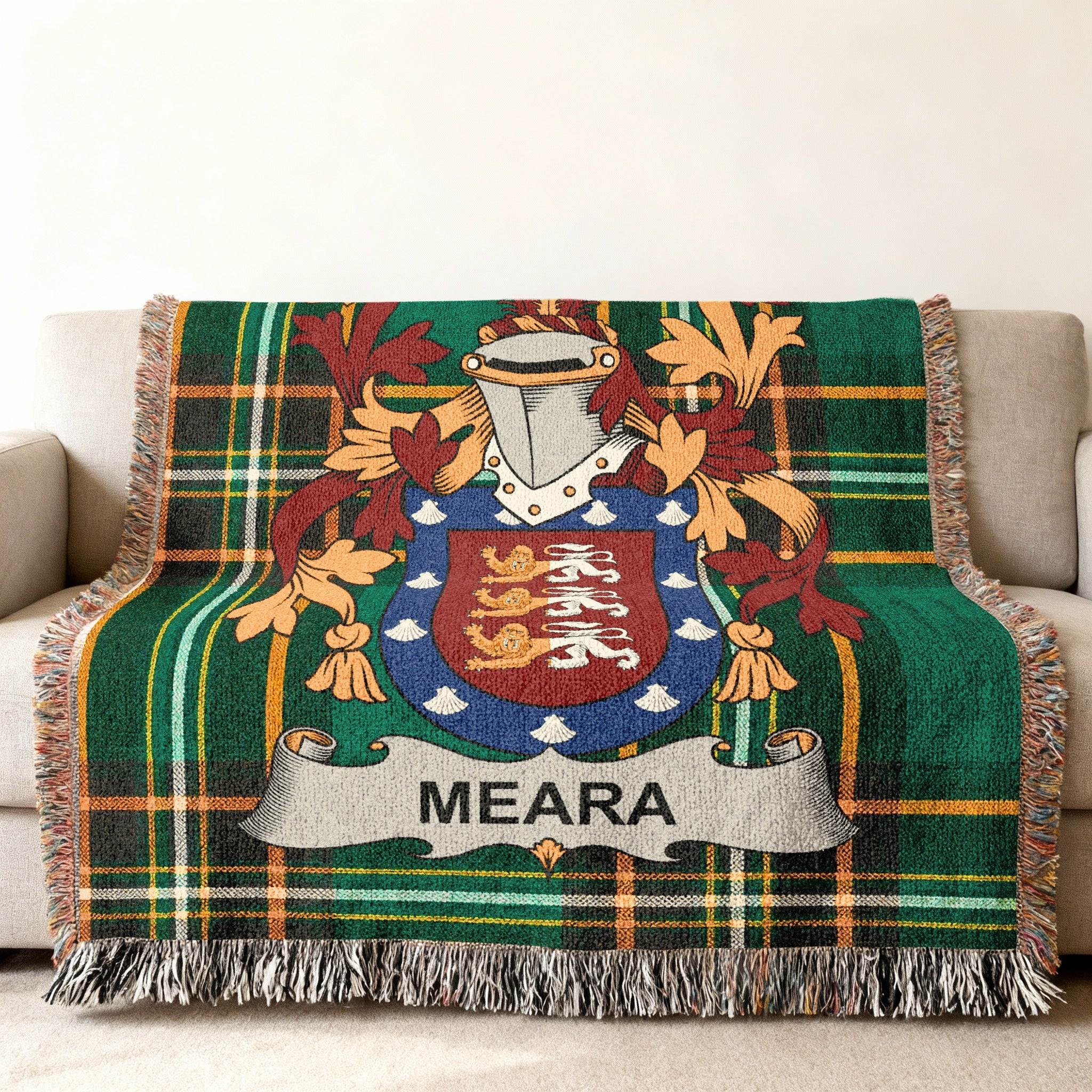 Green plaid throw blanket with Meara family crest.
