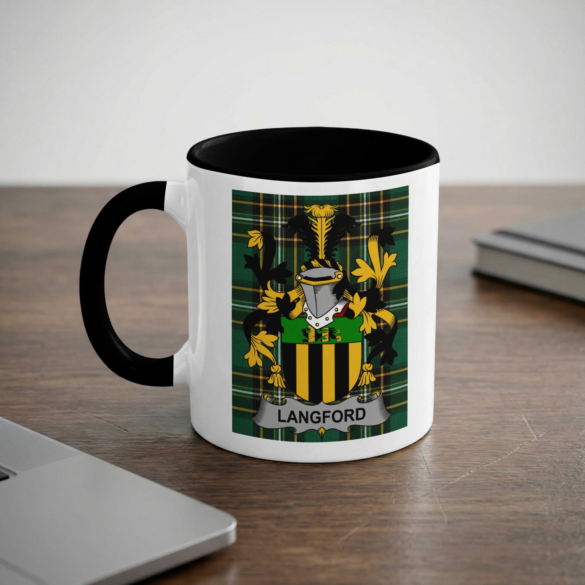 Mug with Langford family crest on a dark wood desk.