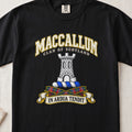 MacCallum Scottish clan T-shirt in Black, front view with a silver stone tower and motto design.