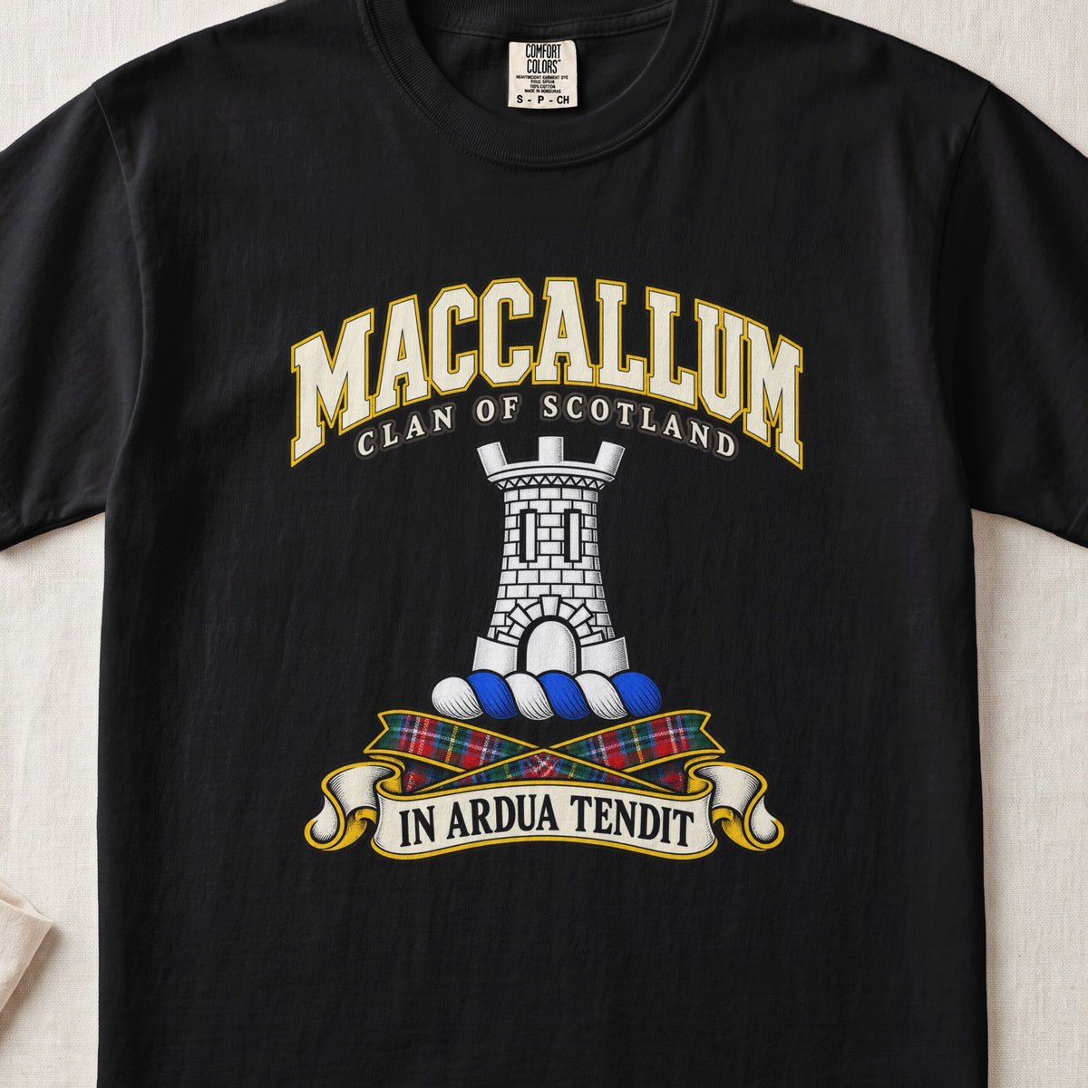 MacCallum Scottish clan T-shirt in Black, front view with a silver stone tower and motto design.