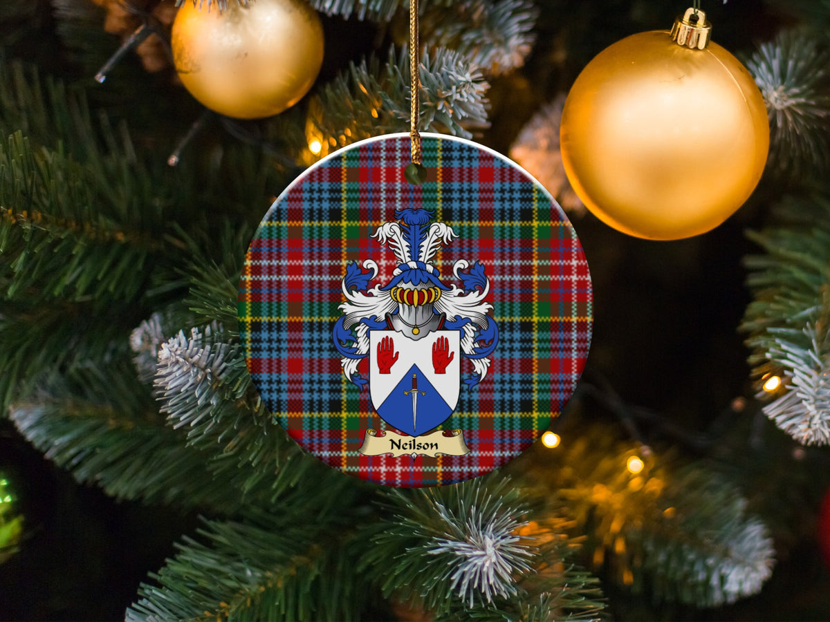 Neilson family emblem ceramic Christmas ornament with Caledonia tartan background in festive holiday décor