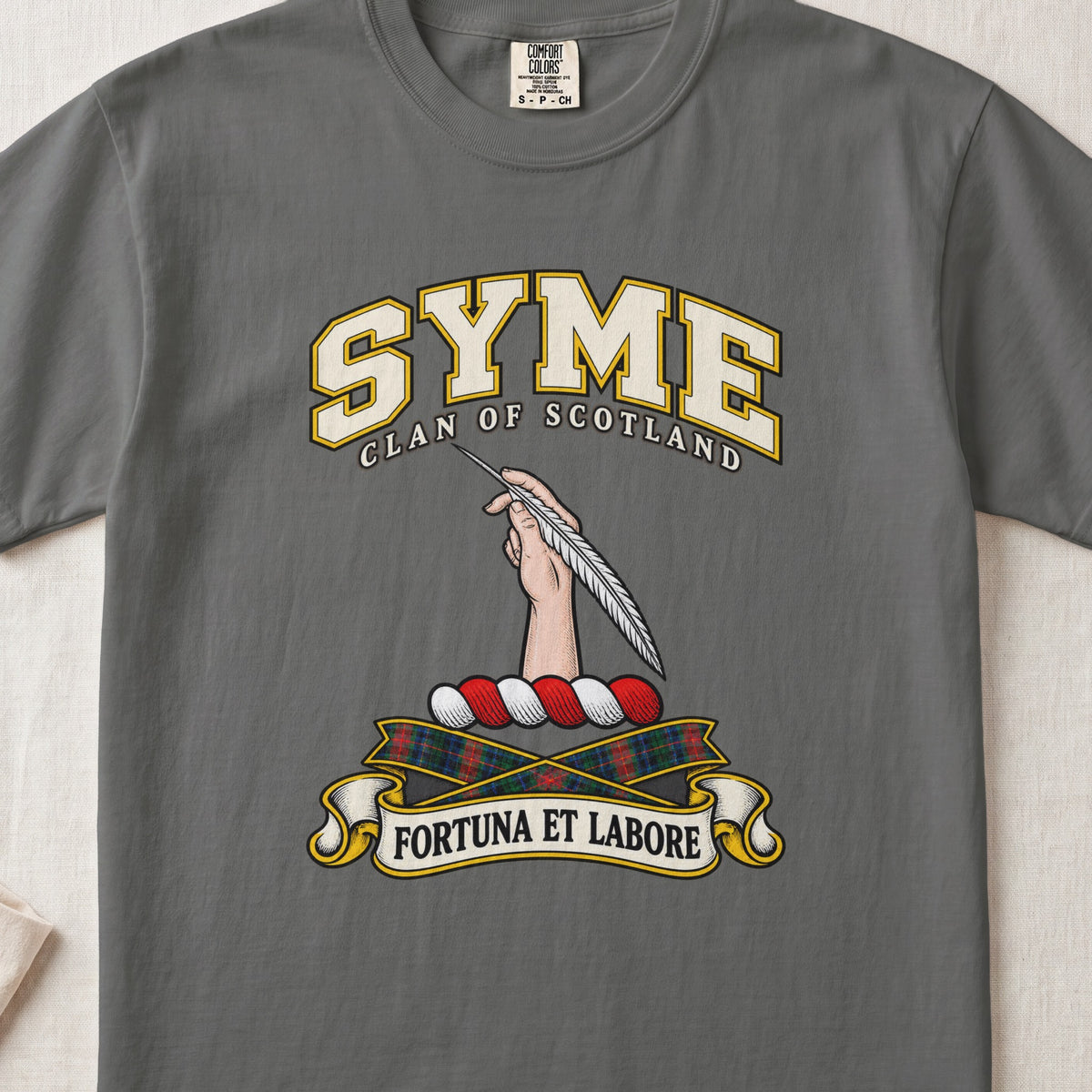 Syme Scottish clan T-shirt in Pepper, front view with a hand holding a feather and motto design.