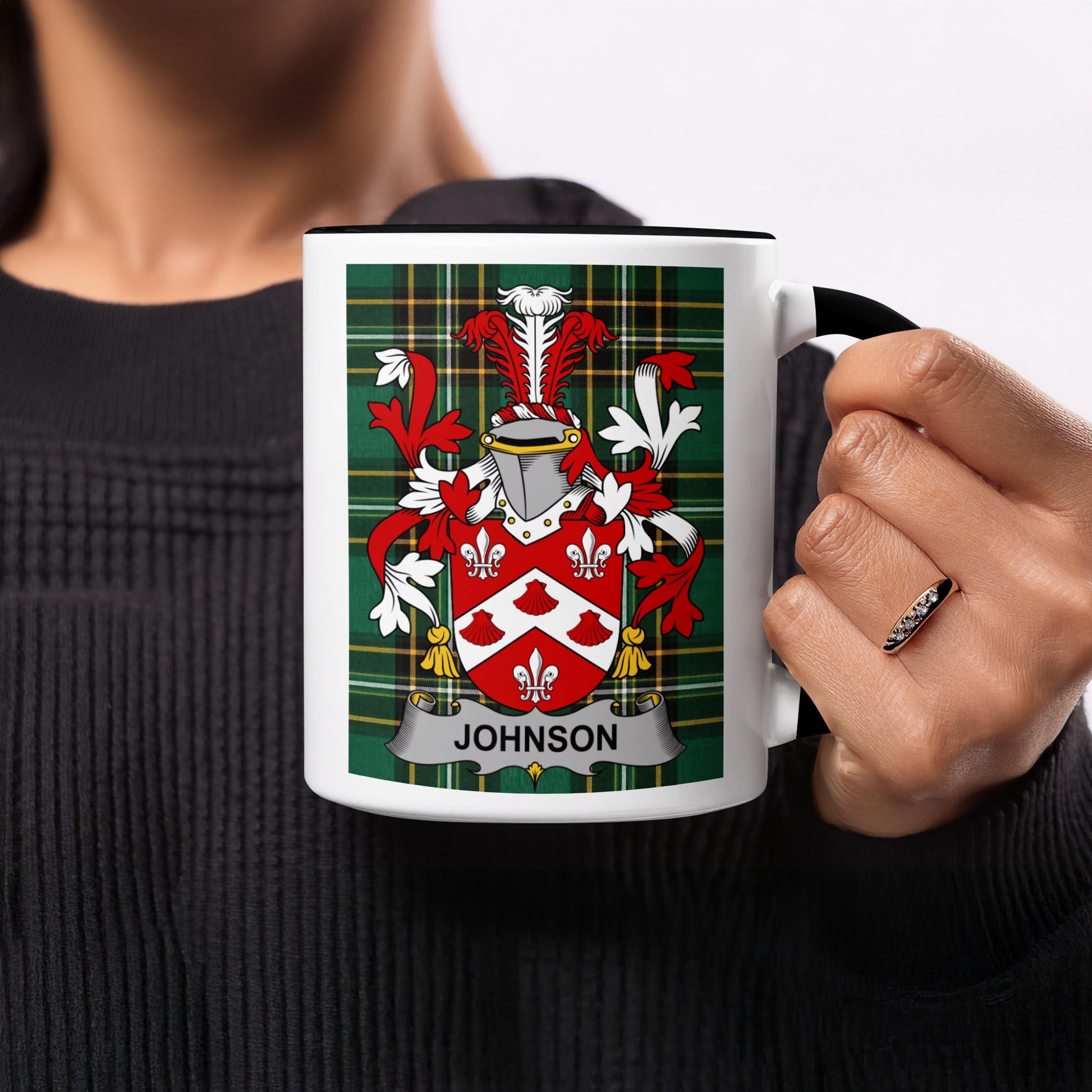 White mug with a green plaid background and the surname "Johnson" crest.