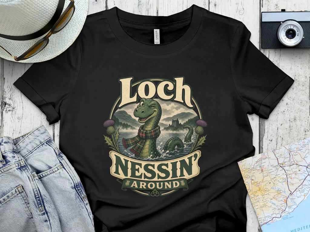 Black t-shirt featuring cartoon Loch Ness Monster and "Loch Ness Around" text.