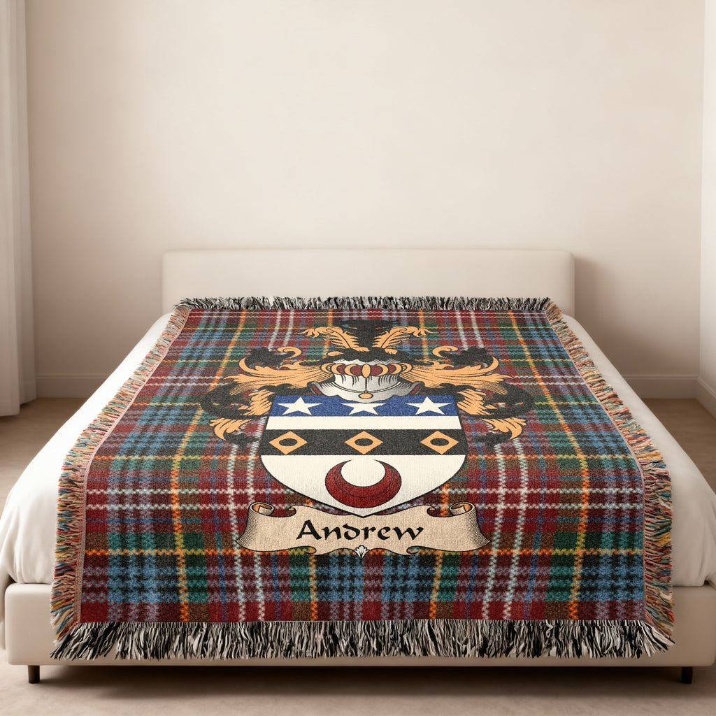 Andrew family crest emblem on a Caledonia tartan woven blanket