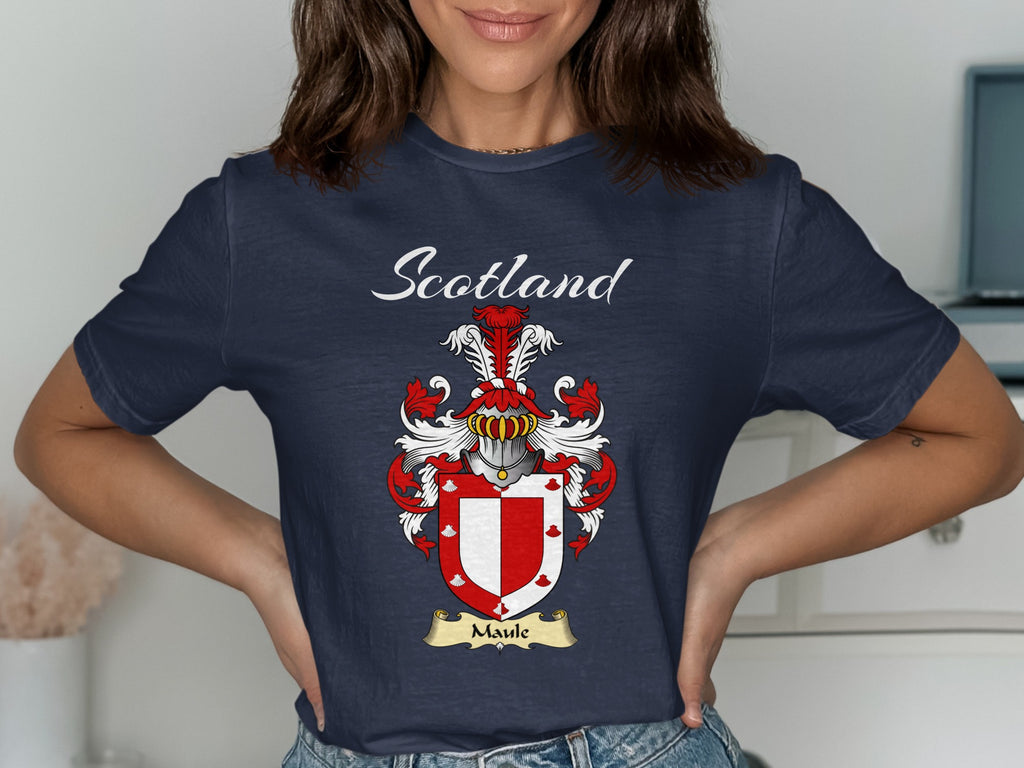 Model wearing a navy Maule T-shirt featuring a red-and-white shield with a contrasting border