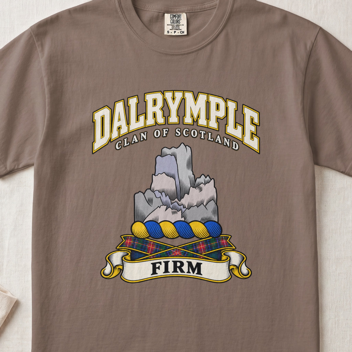 Dalrymple Scottish clan T-shirt in Espresso, front view with a gray rock formation and motto design.