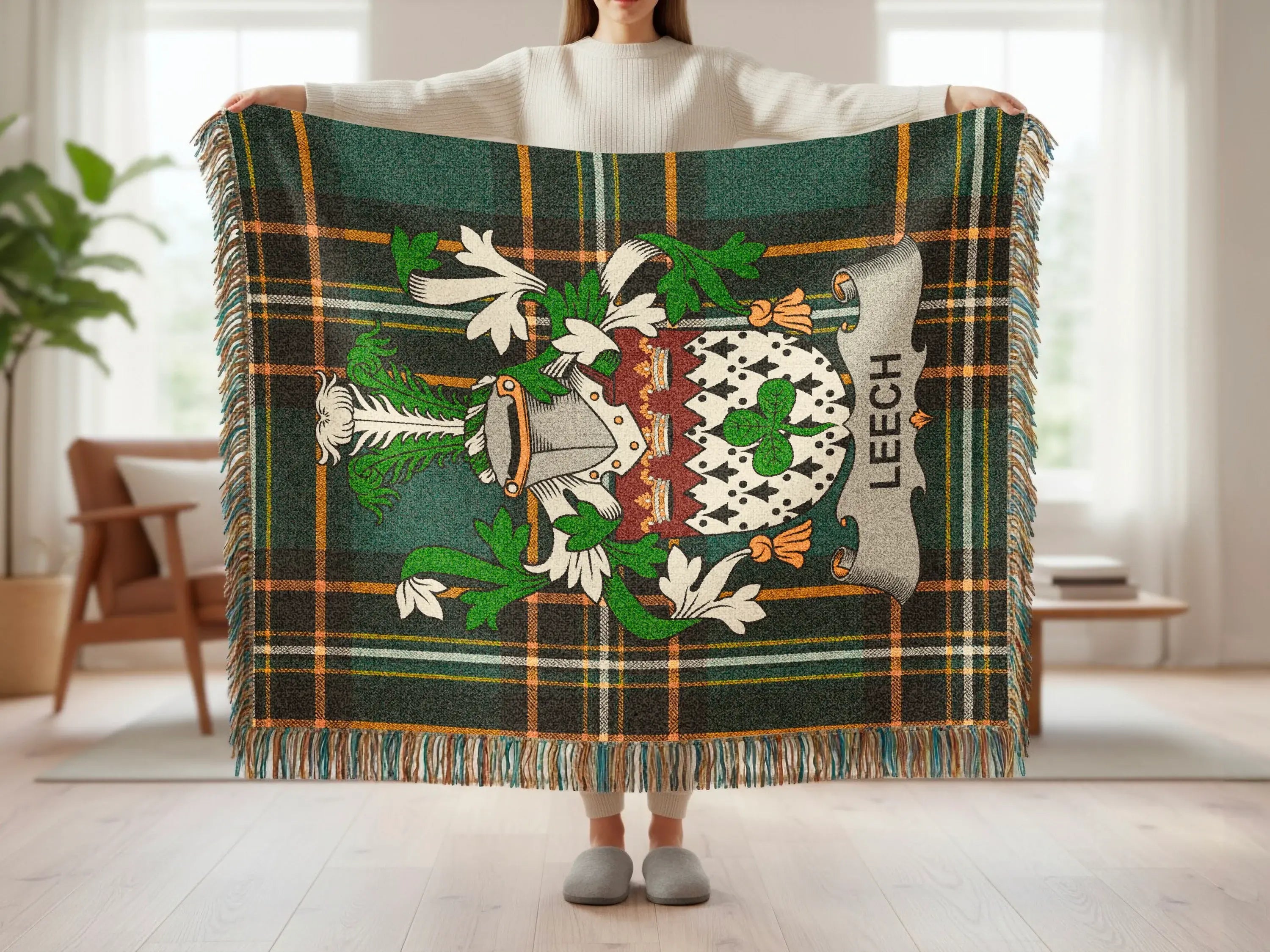 Green, white, and gold plaid blanket with a coat of arms and the text "LEECH".