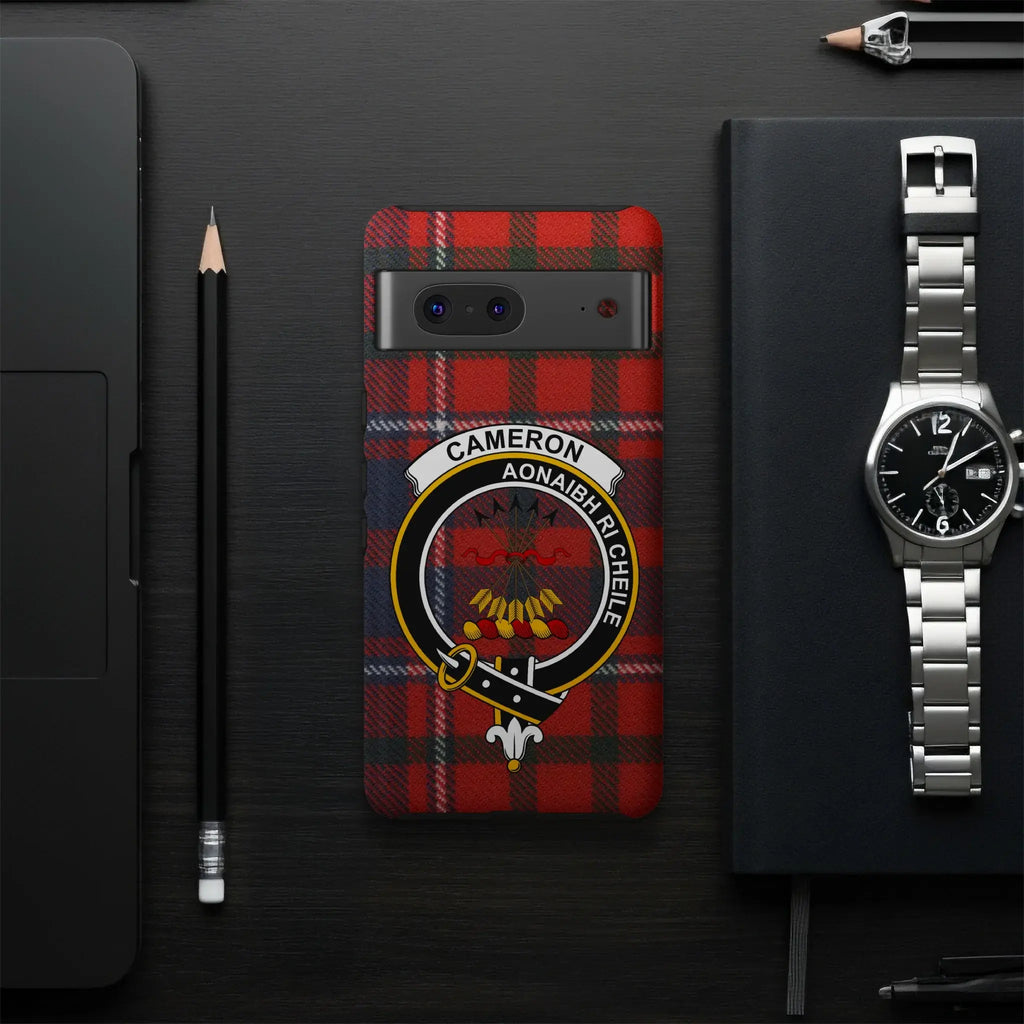 Cameron tartan phone case flat lay — full red clan crest print with Unite motto visible