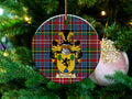 Murchison Scottish clan ceramic ornament with family crest on a Caledonia tartan background, hanging on a Christmas tree