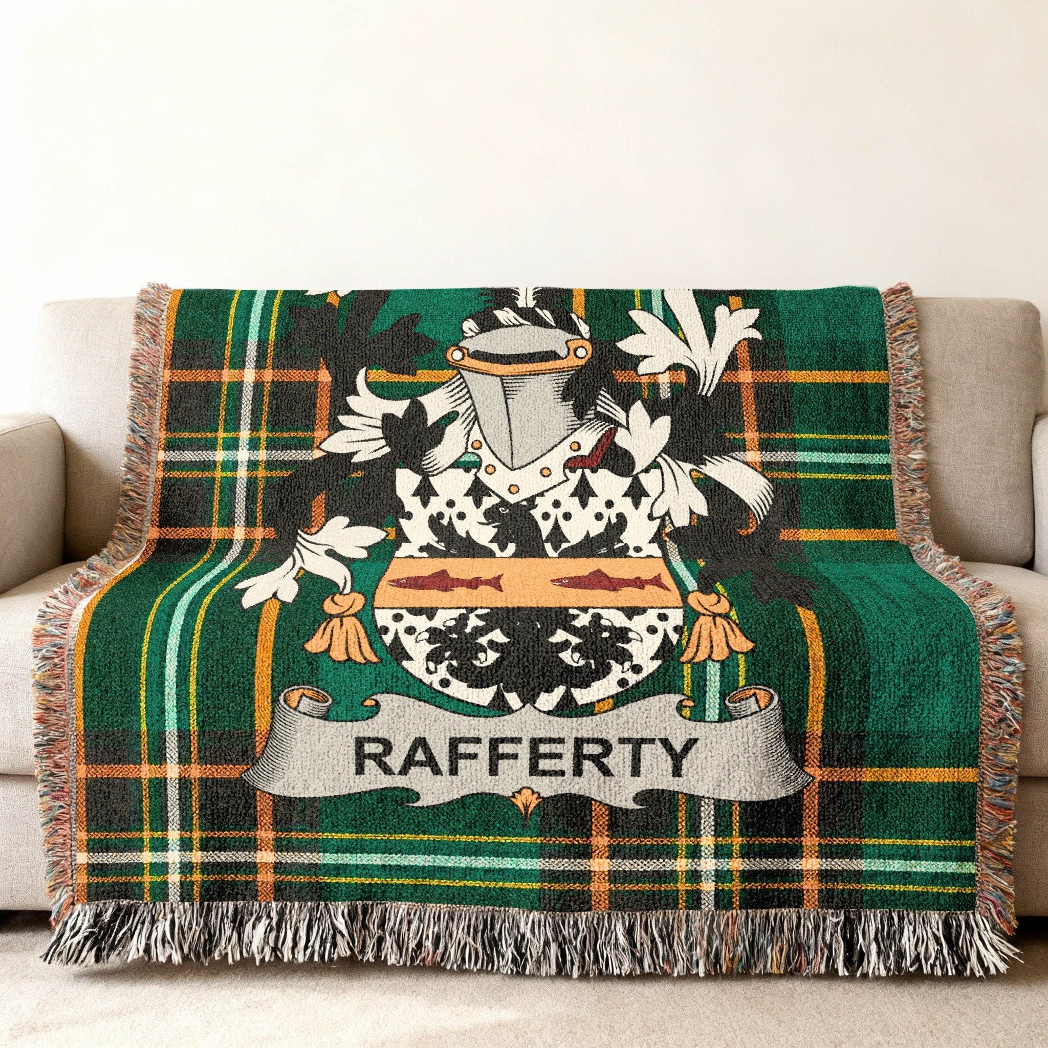 Green plaid throw blanket with Rafferty family crest and name.