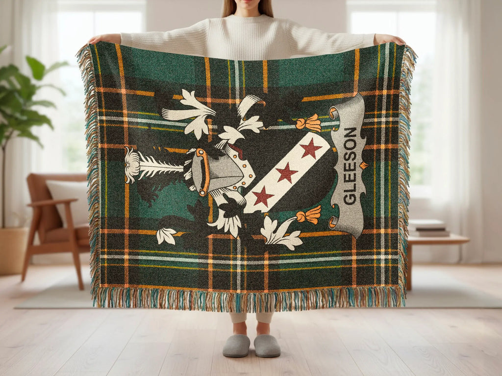 Green and gold plaid throw with a crest and "GLEESON" banner.