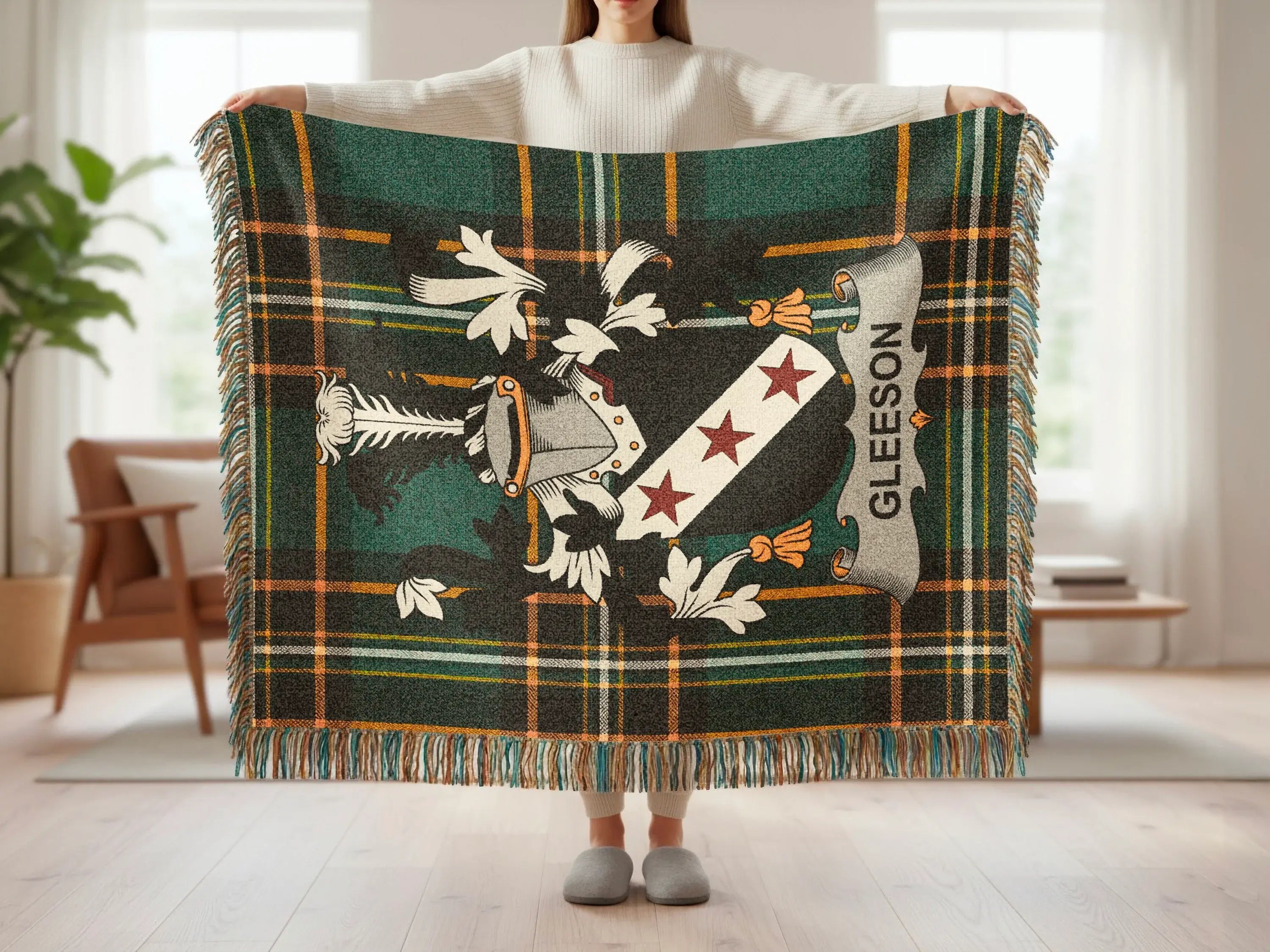 Green and gold plaid throw with a crest and "GLEESON" banner.