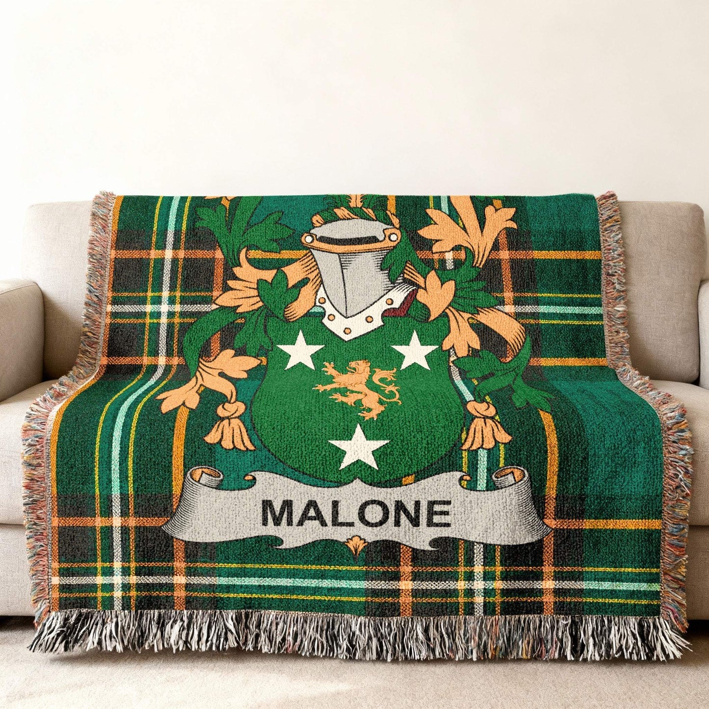 Green tartan throw blanket with Malone family crest and name.