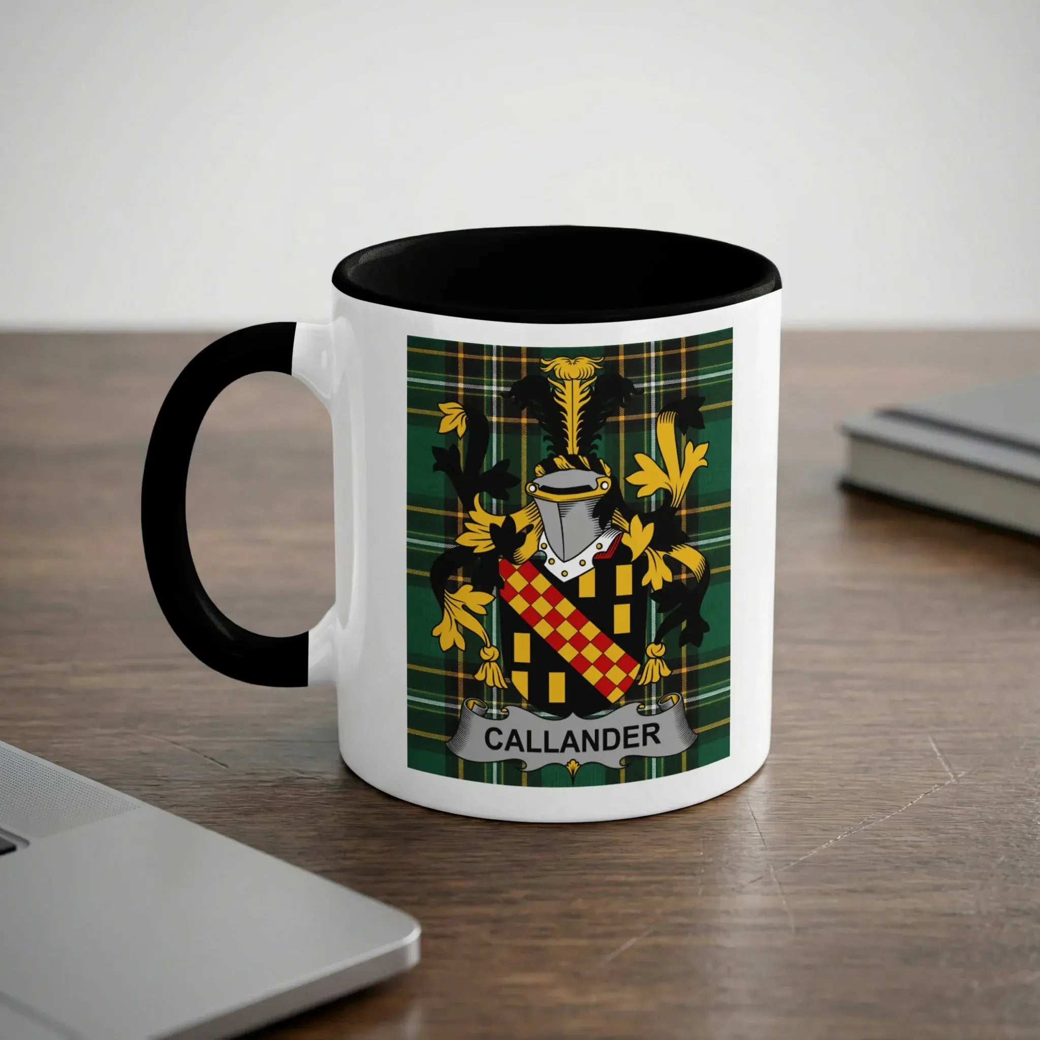White mug with black handle featuring a Callander family crest with plaid background.