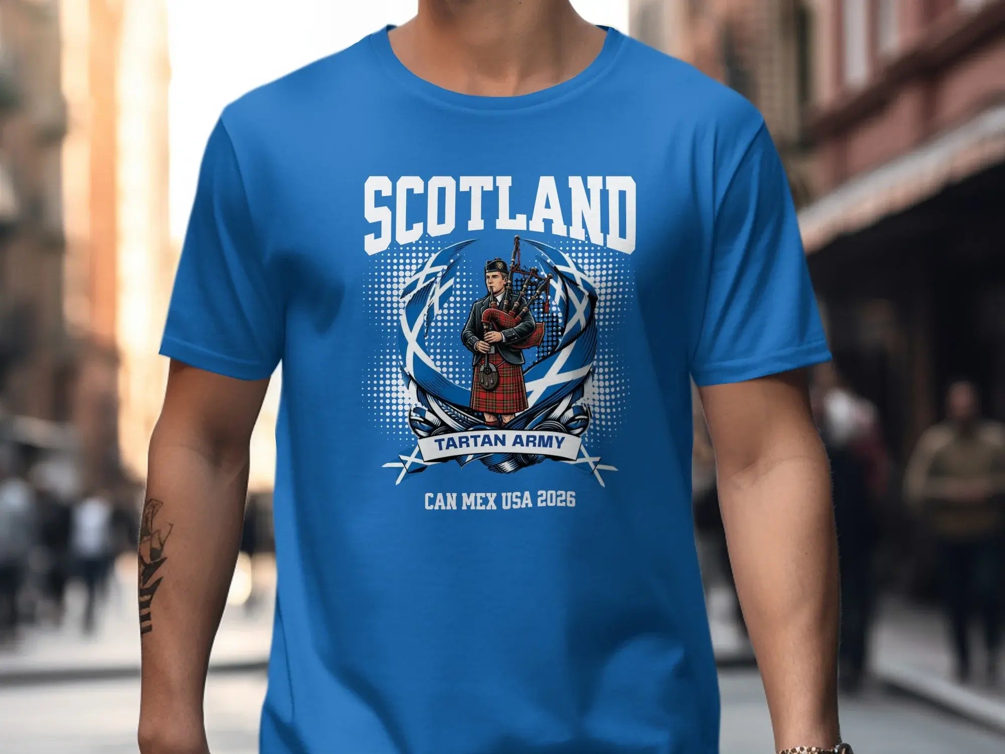 T-shirt with Scotland Tartan Army logo featuring bagpiper and "Can Mex USA 2026".