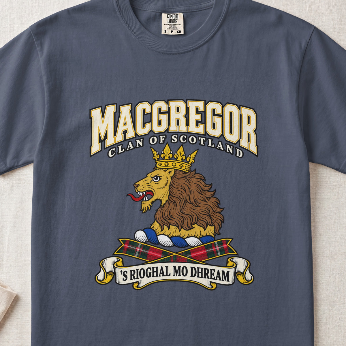 MacGregor graphic T-shirt in Midnight blue, front flat lay showing varsity lettering and gold lion head with brown mane and gold crown.