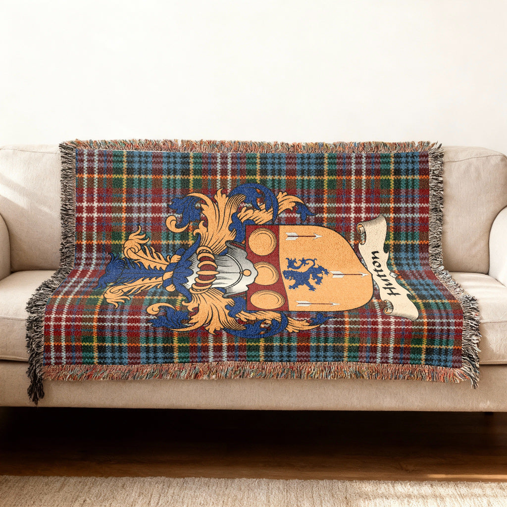 Hutton Scottish woven blanket with family shield and Caledonia tartan background