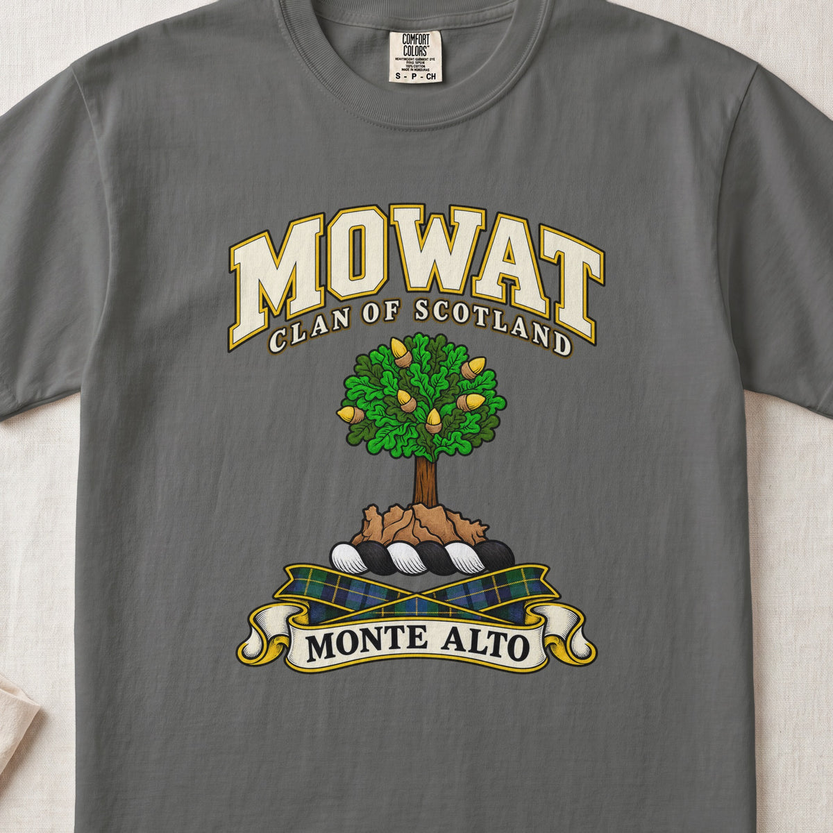 Mowat Scottish clan T-shirt in Pepper, front view with a green tree on a rocky mound and motto design.