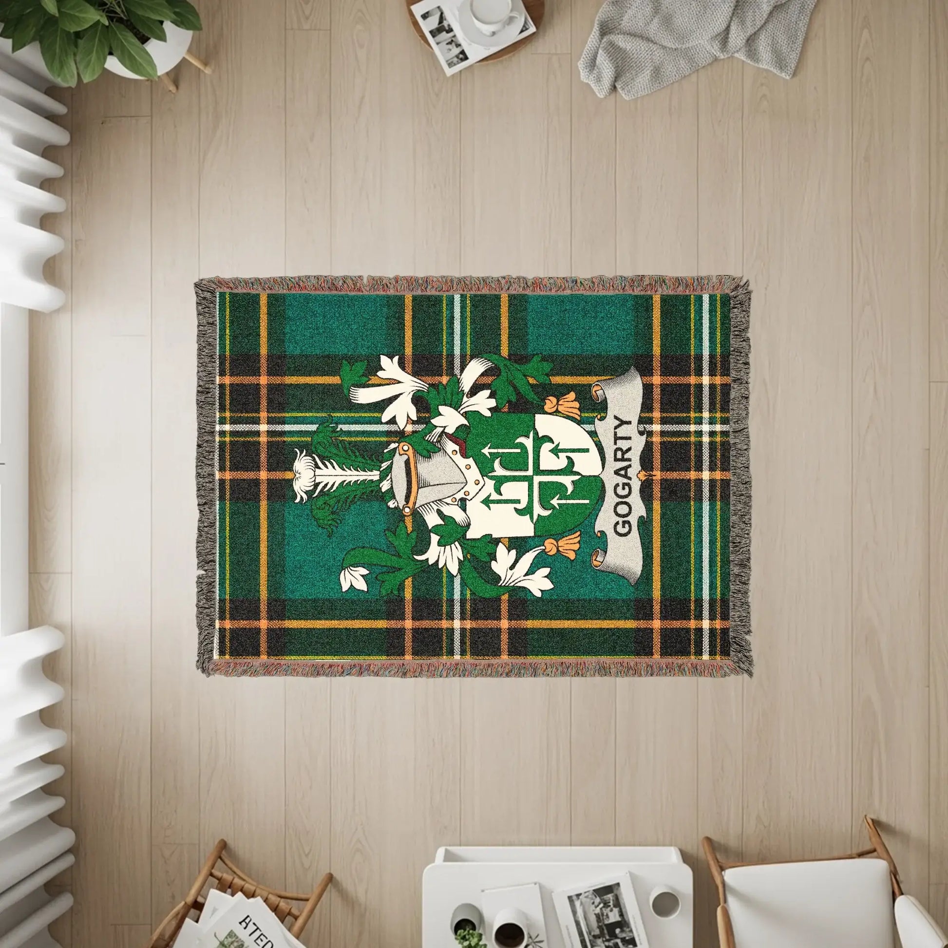 Gogarty family crest on a green tartan woven blanket.
