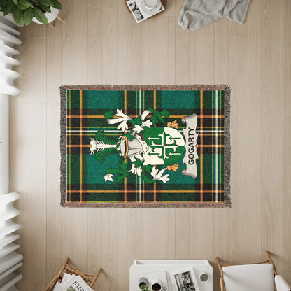 Gogarty family crest on a green tartan woven blanket.