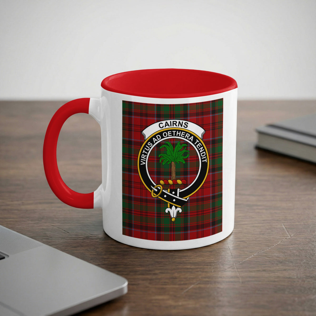 Cairns Scottish family crest artwork on an 11 oz red accent mug with a tartan background