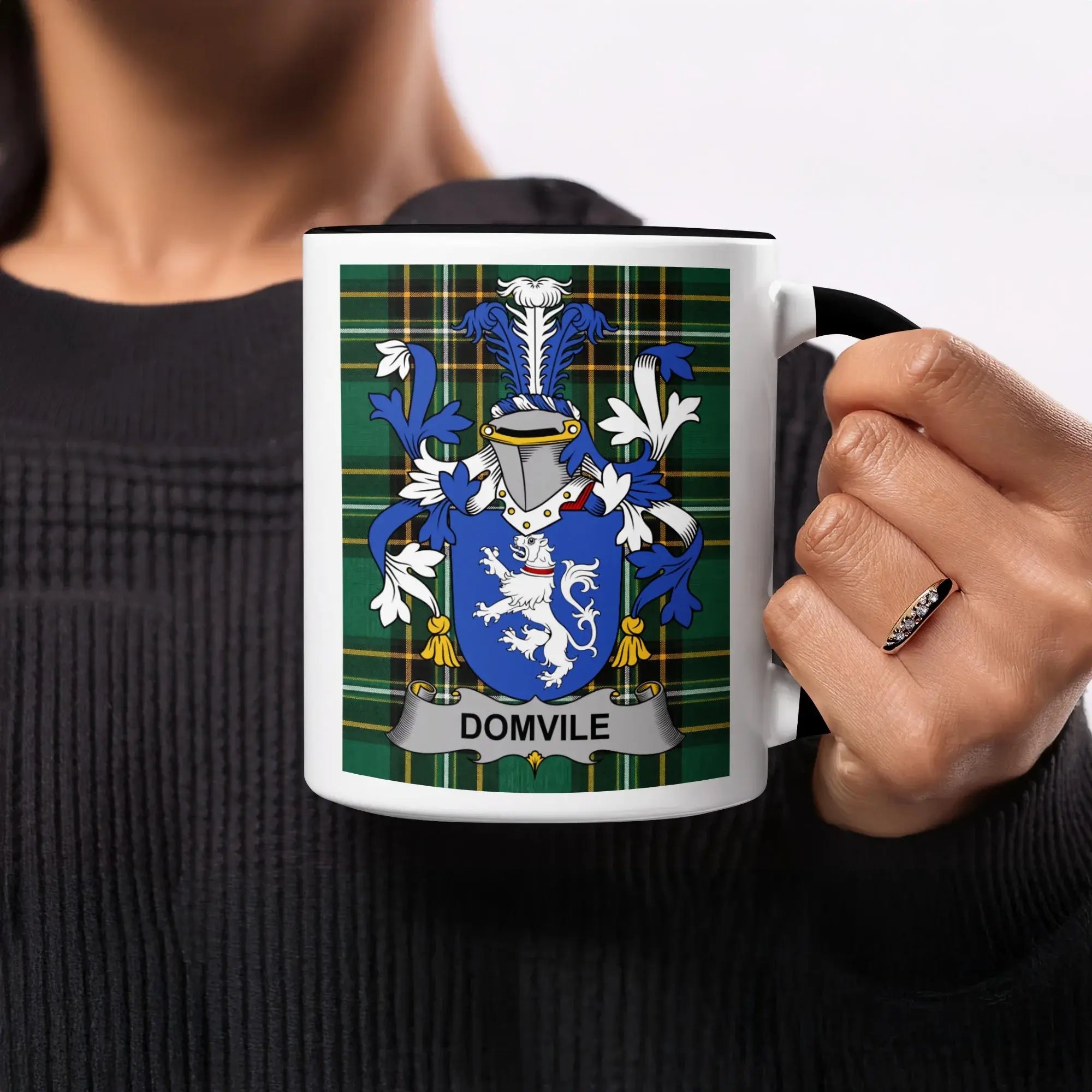 Mug with Domvile family crest on a plaid background.