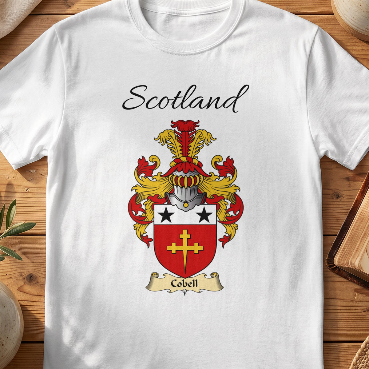 White Cobell Scottish family shield T-shirt featuring a gold cross beneath black stars on red