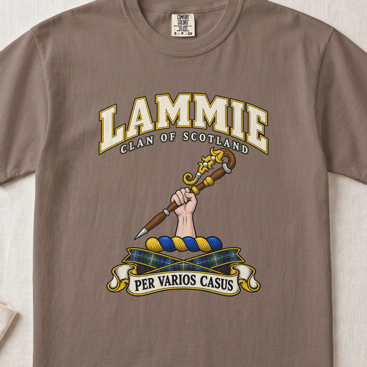Lammie Scottish clan T-shirt in Espresso, front view with a hand holding an ornate crozier and motto design.