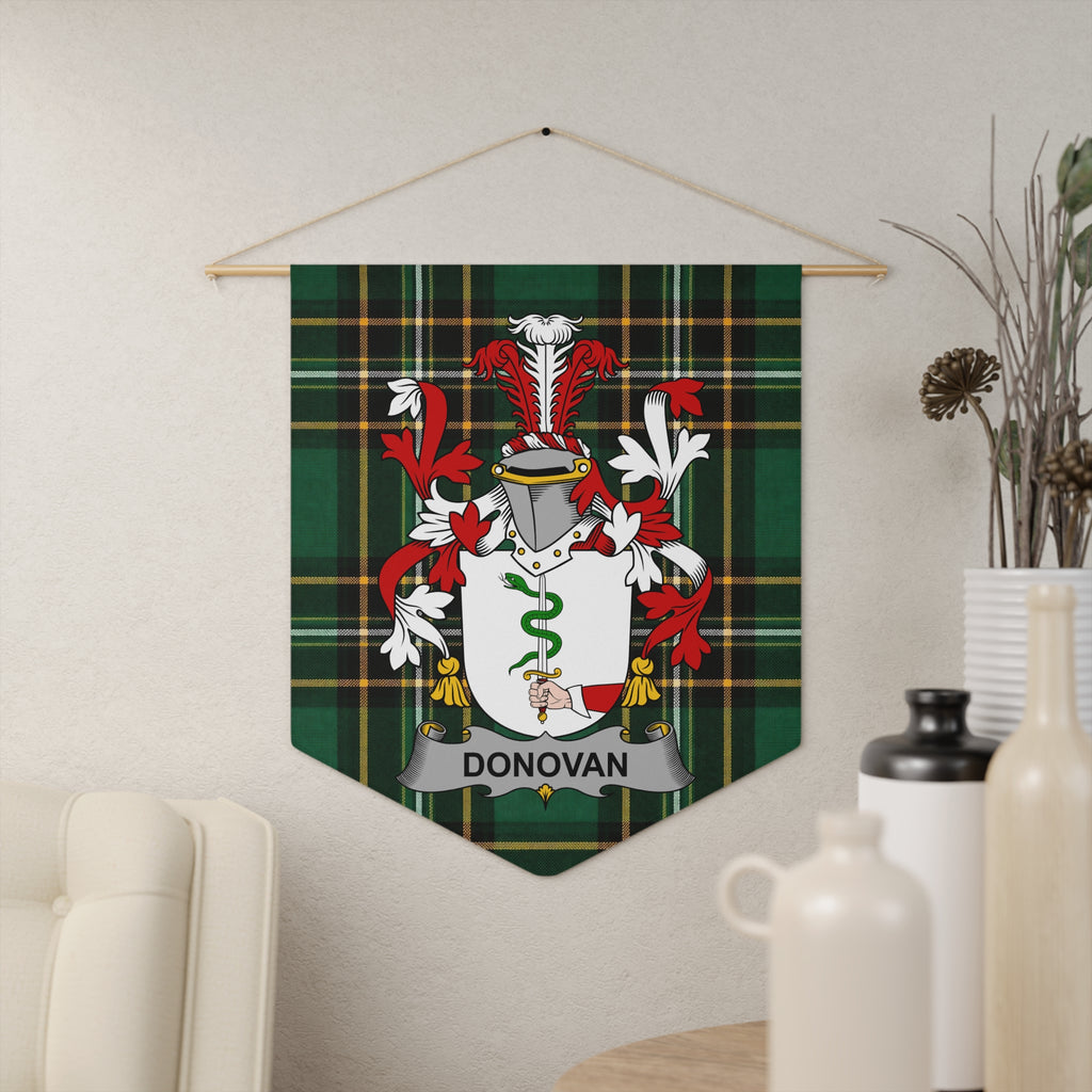 Donovan family crest on green tartan pennant hanging on a wall.