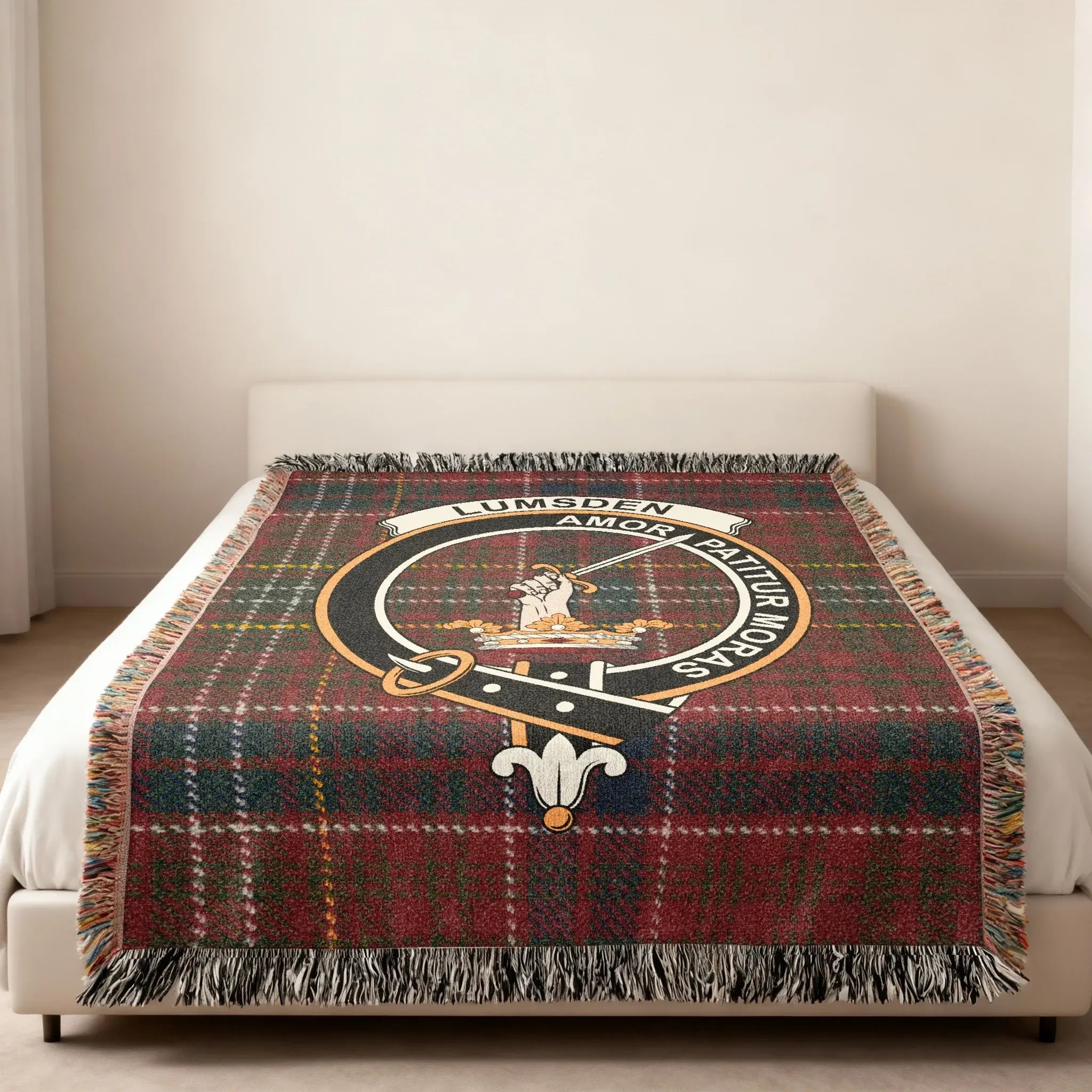 Clan Lumsden tartan woven blanket — lifestyle shot showing Amor Patitur Moras motto and fringe border