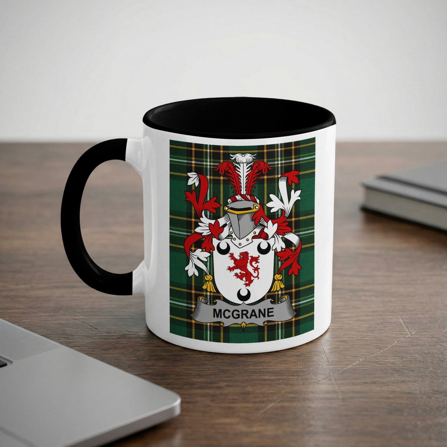 White mug with black handle featuring the "McGrane" coat of arms on a tartan background.