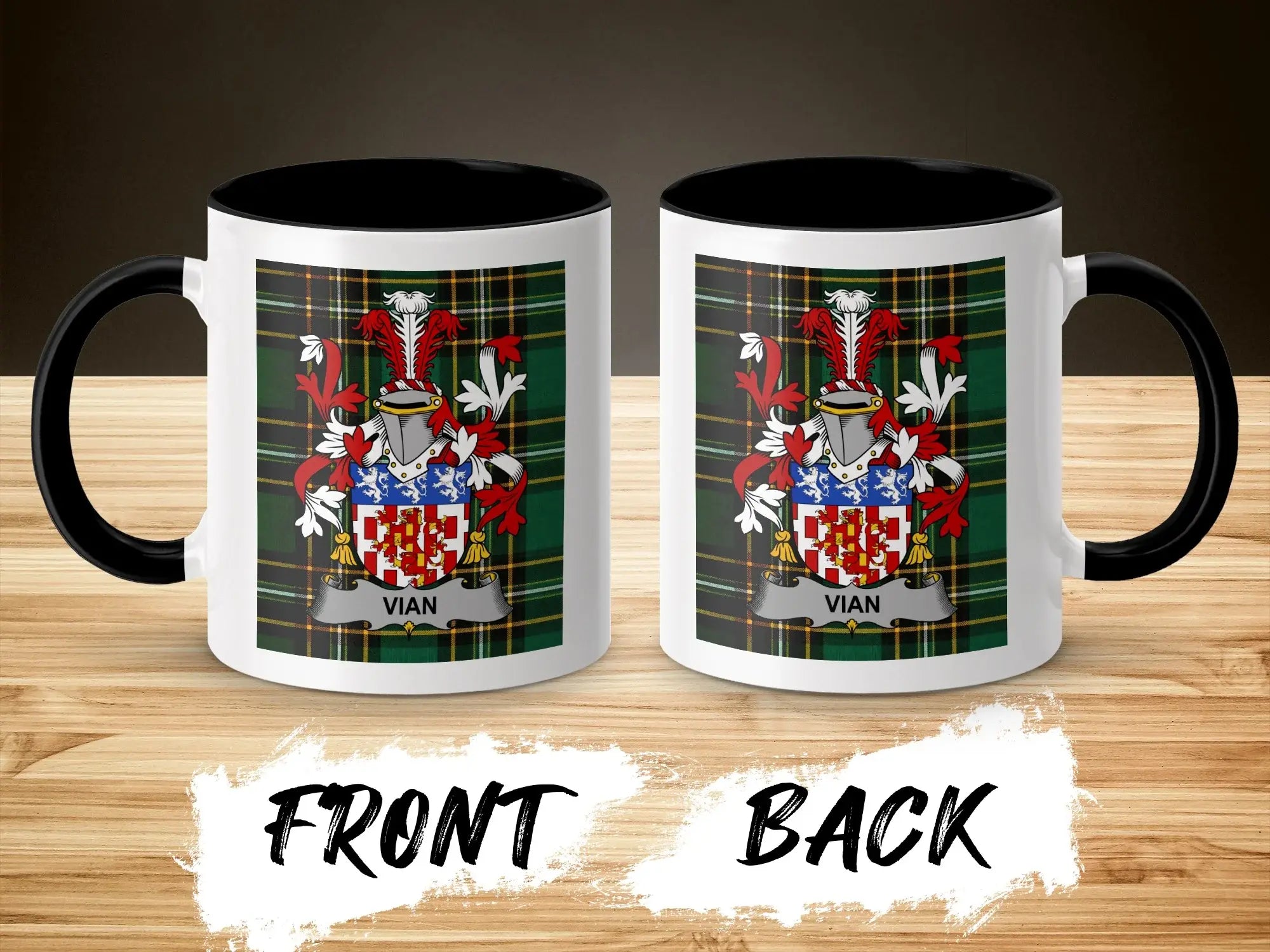 Two mugs with Vian family crest on plaid pattern, wood background.