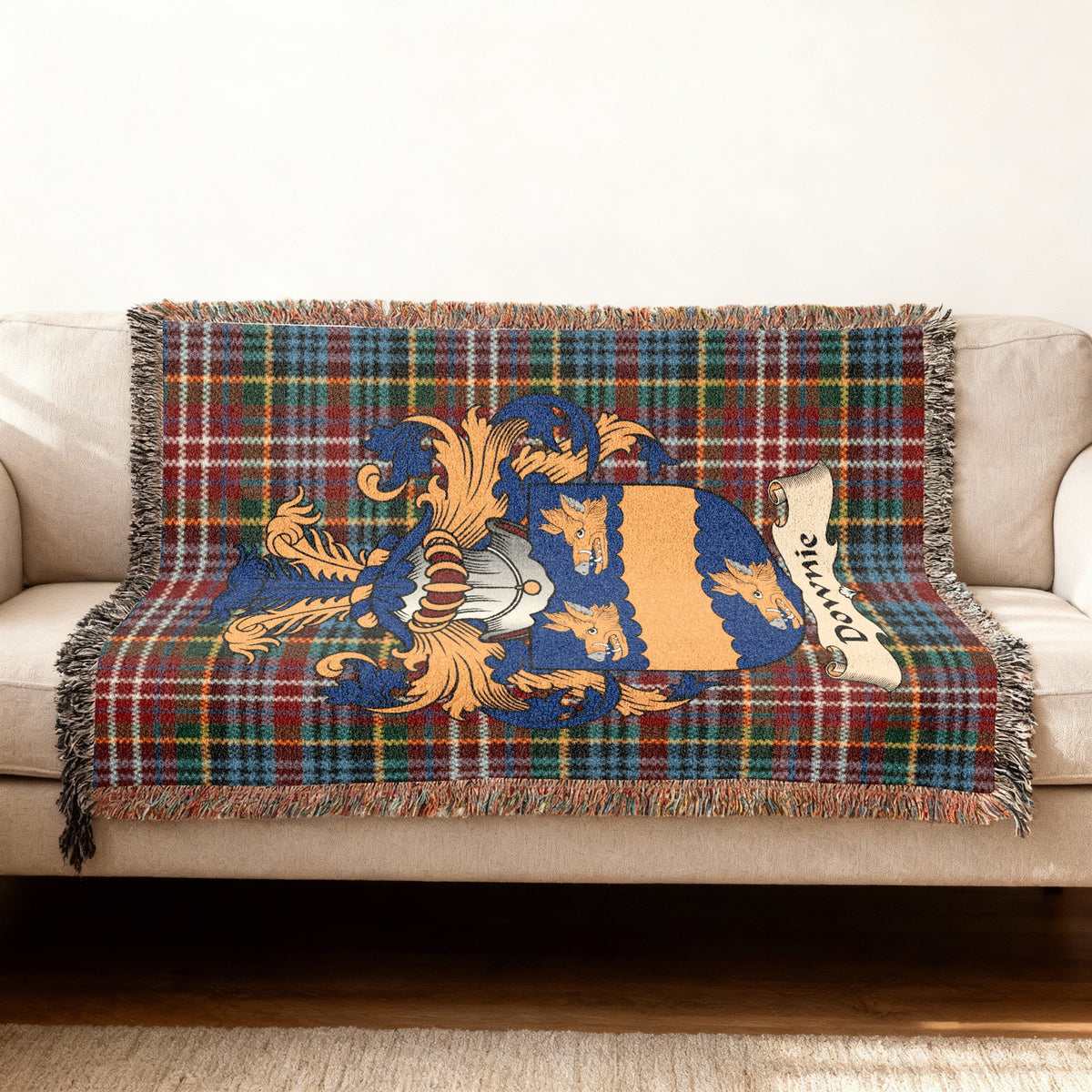 Downie Scottish woven blanket with family shield and Caledonia tartan background