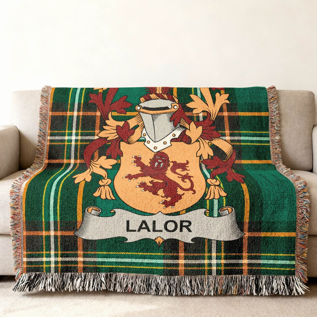 Green plaid throw blanket with LALOR family crest.