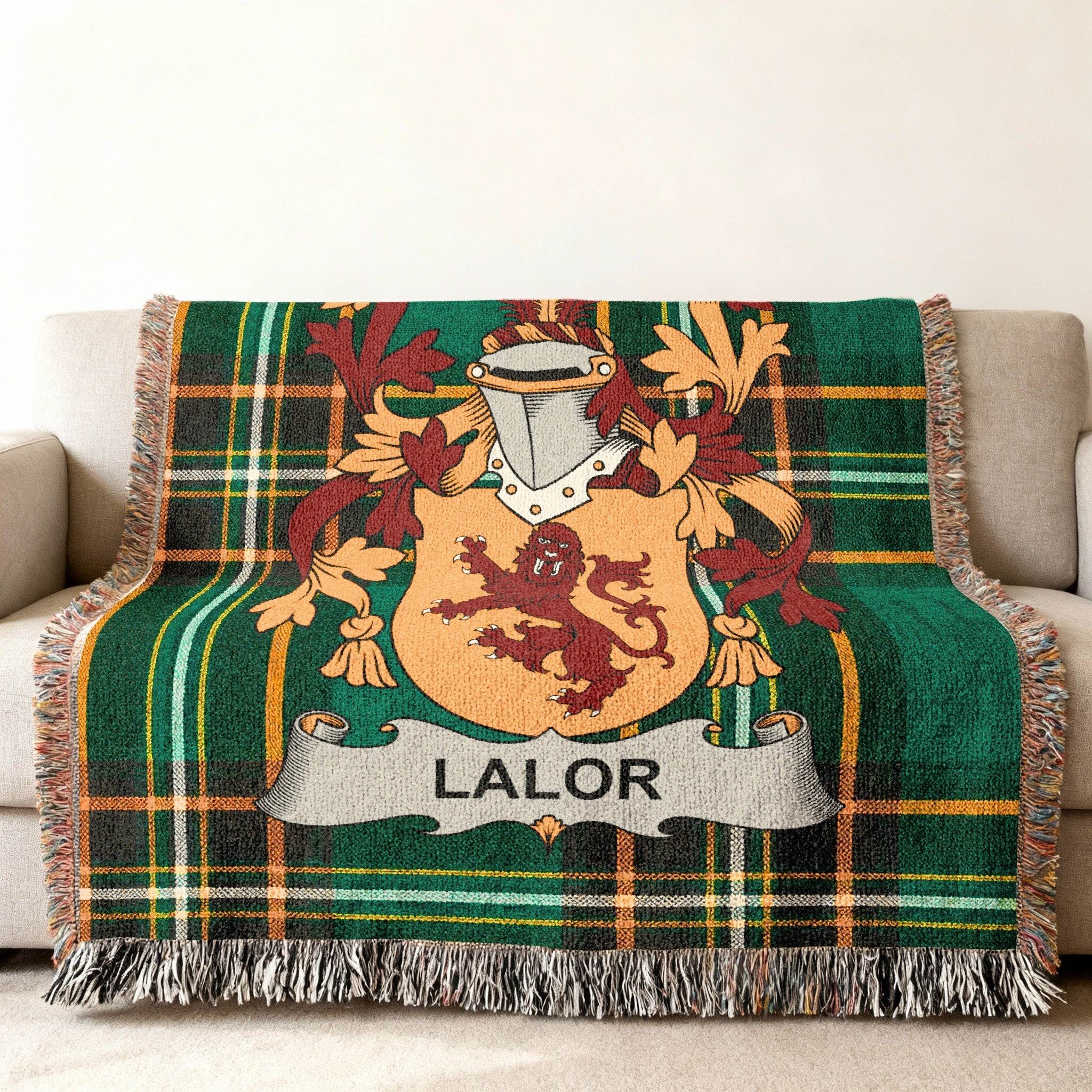 Green plaid throw blanket with LALOR family crest.