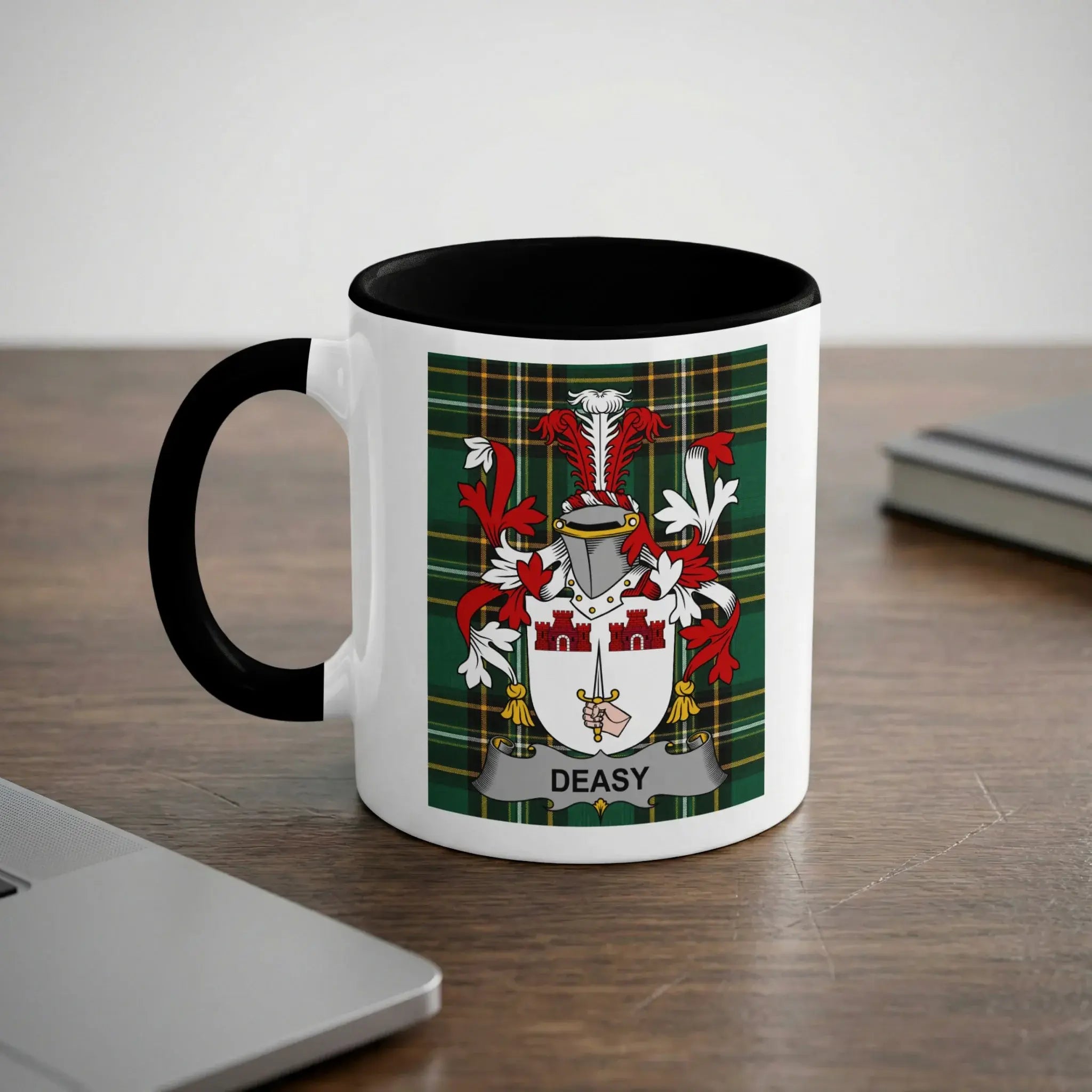White mug with black handle featuring the DEASY family crest on a tartan background.