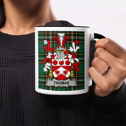 Mug featuring the Thomas family crest on a green plaid background.