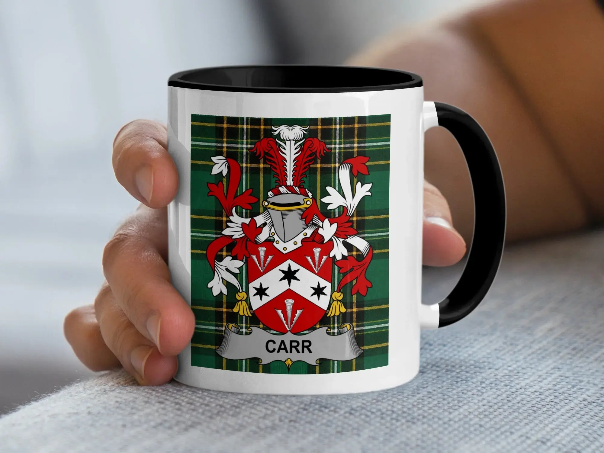 White mug with black rim featuring a green tartan and the "CARR" coat of arms.