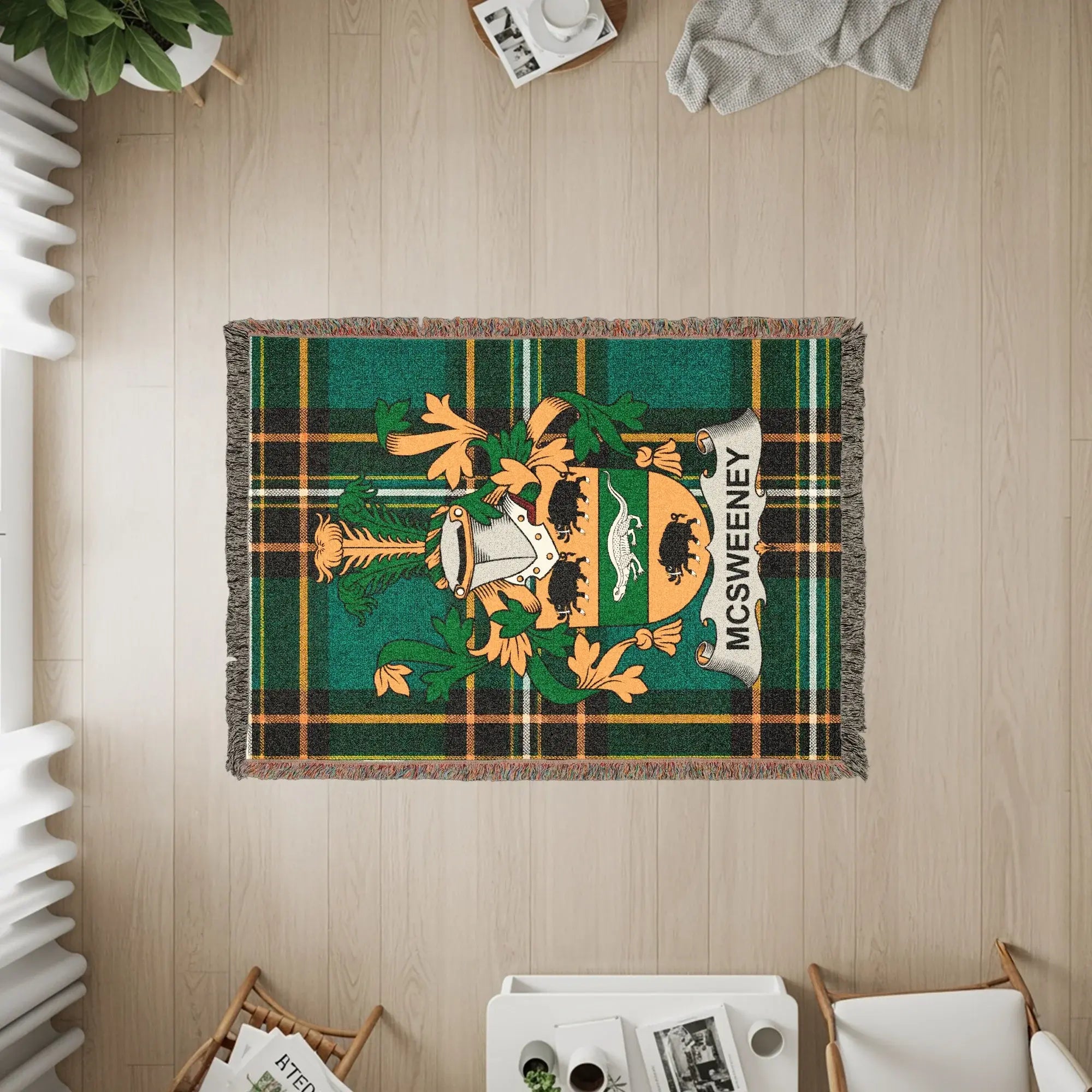 McSweeney tartan blanket with family crest on wooden floor.