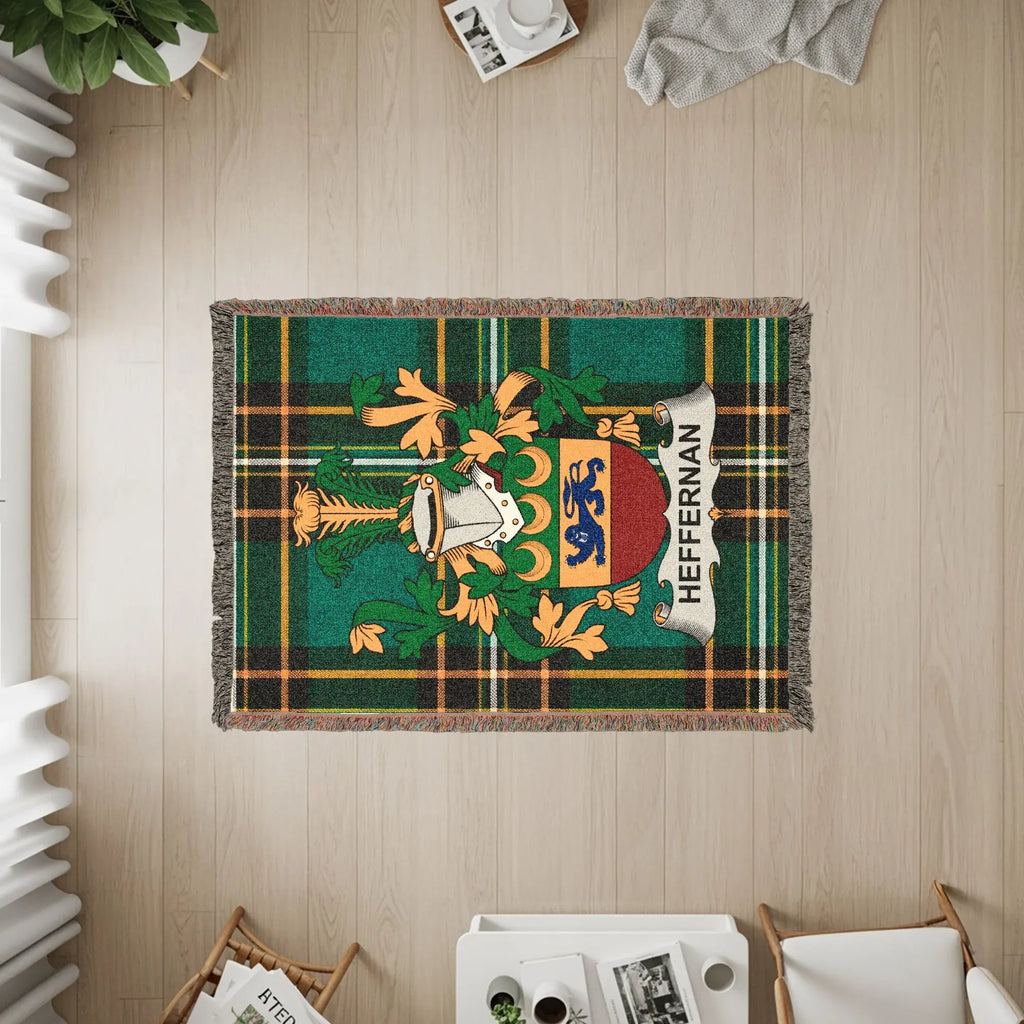 Heffernan crest on green plaid woven throw blanket.