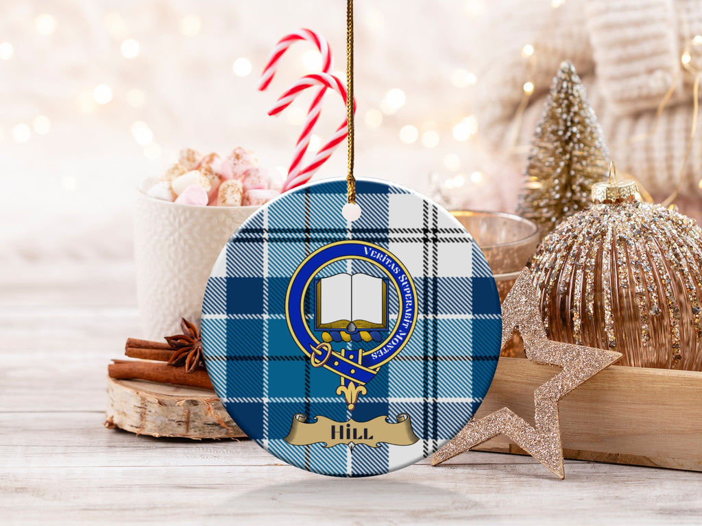 Hill family crest with open book and Latin motto on blue tartan ornament
