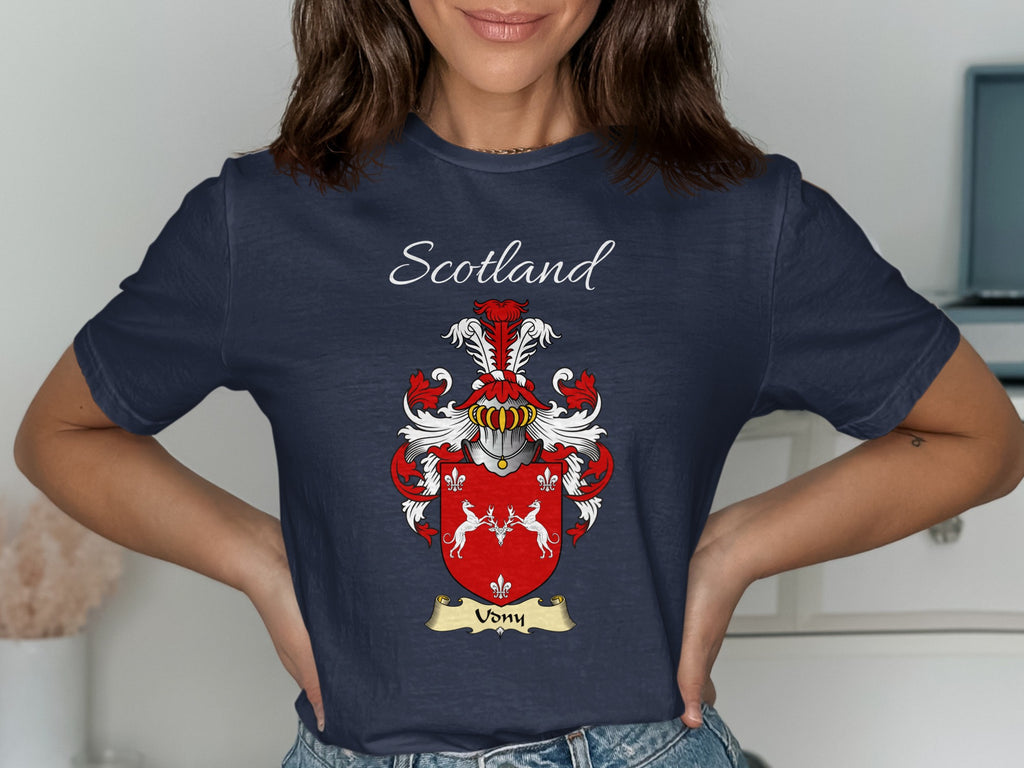 Model wearing the navy Udny family crest T-shirt featuring “Scotland” and the surname banner.