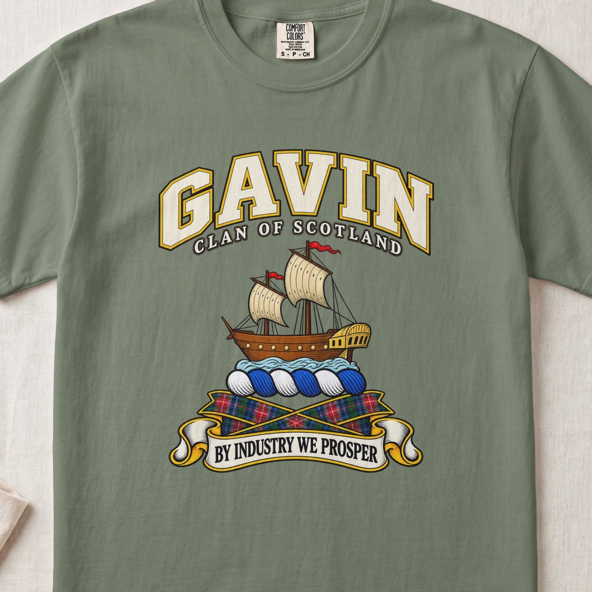 Gavin Scottish clan T-shirt in Moss, front view with a sailing ship on blue waves and motto design.