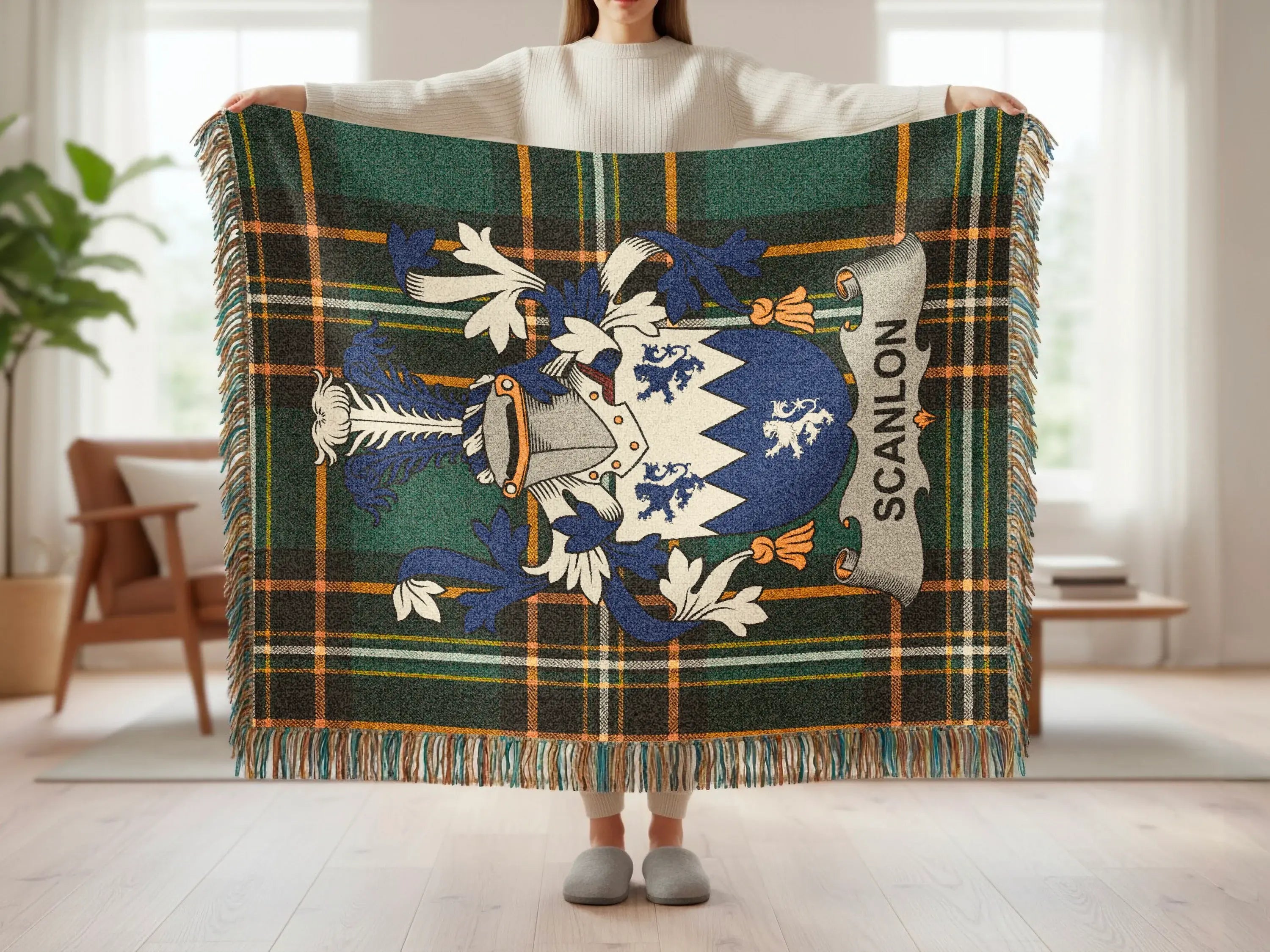 Green, blue, and yellow plaid blanket with family crest and "SCANLON" text.