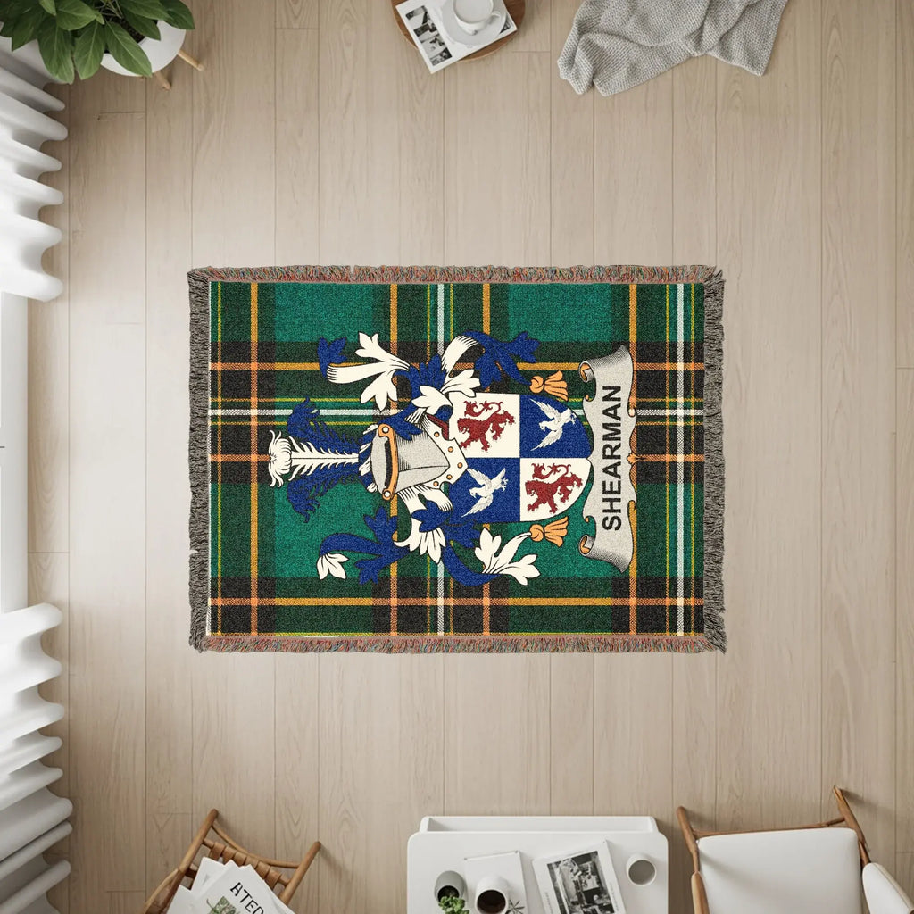 Sherman tartan blanket with family crest in center.