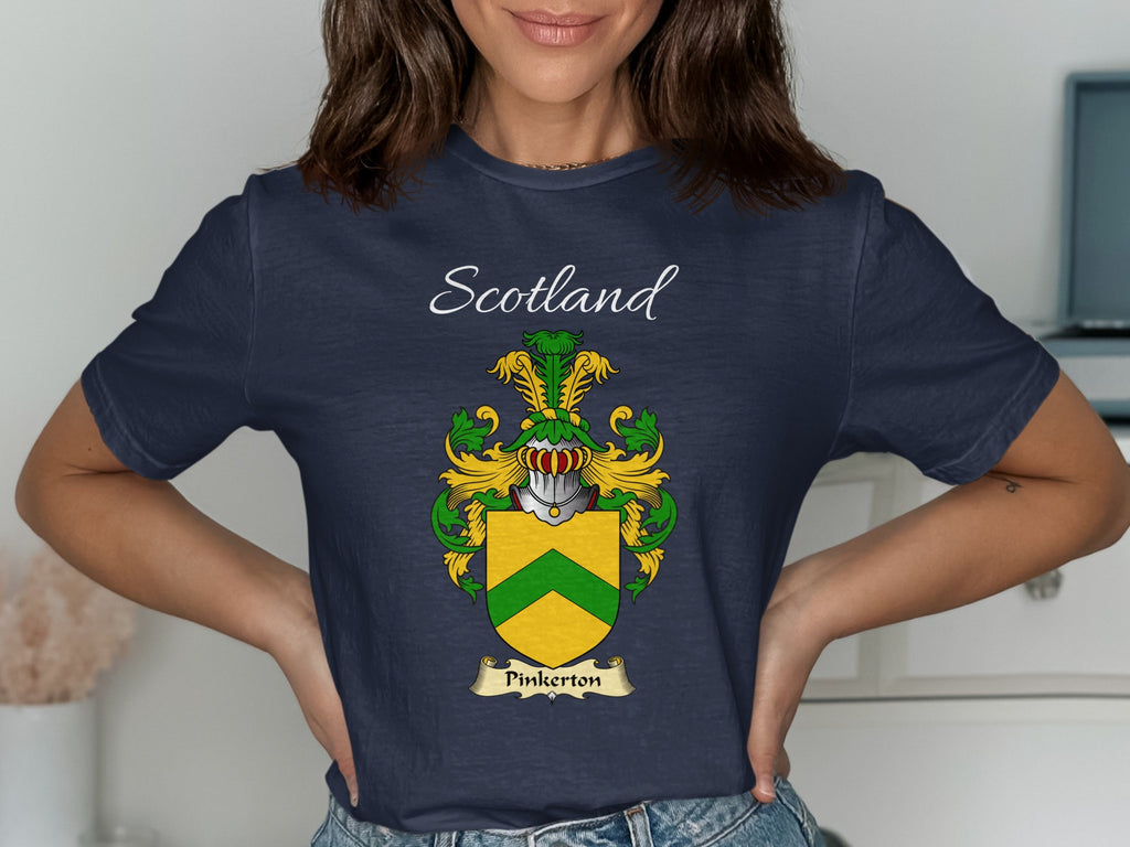 Model wearing the navy Pinkerton family crest T-shirt featuring “Scotland” and the surname banner.